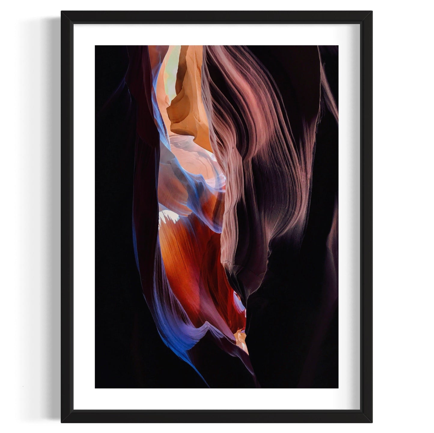 Framed artwork of a colorful abstract design on a black background