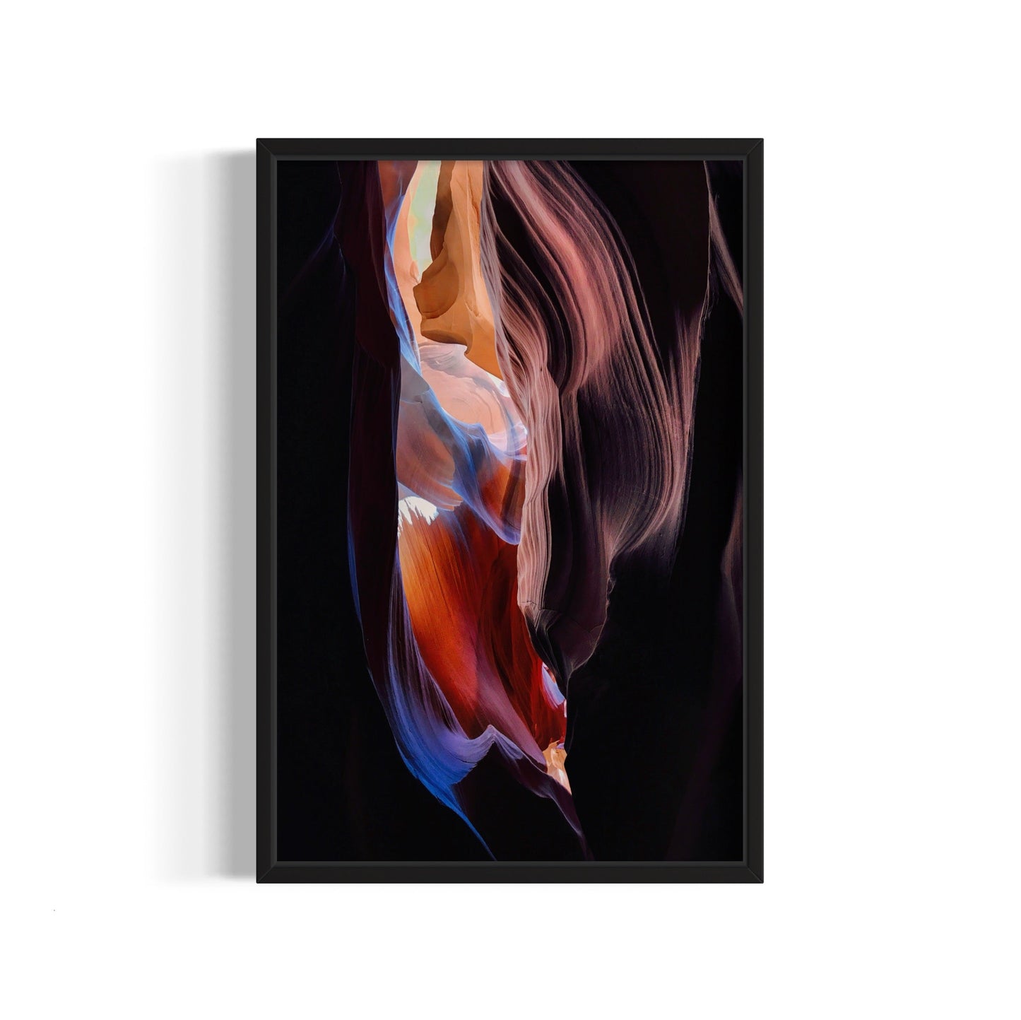 Framed abstract art print with colorful smoke-like design on a white background