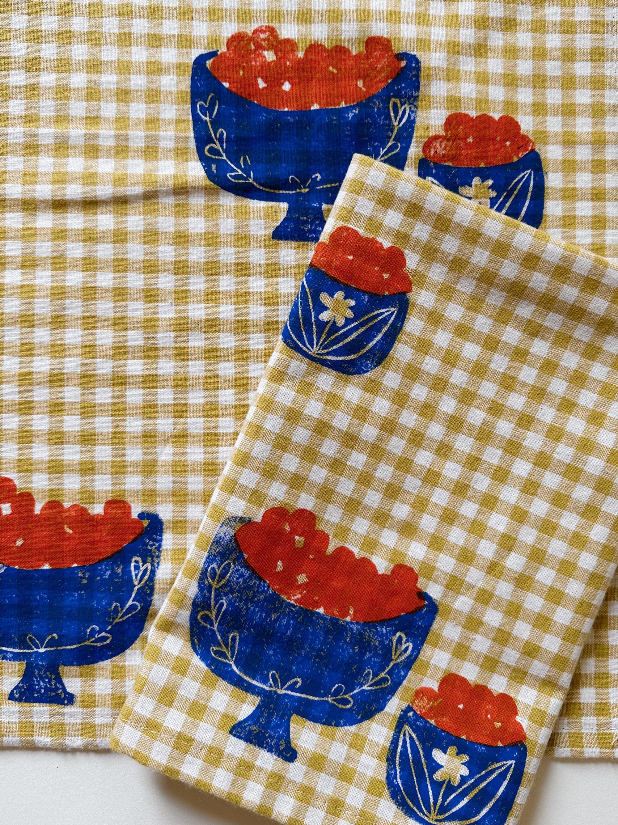 Orange Bowl on Mustard Gingham Dinner Napkins