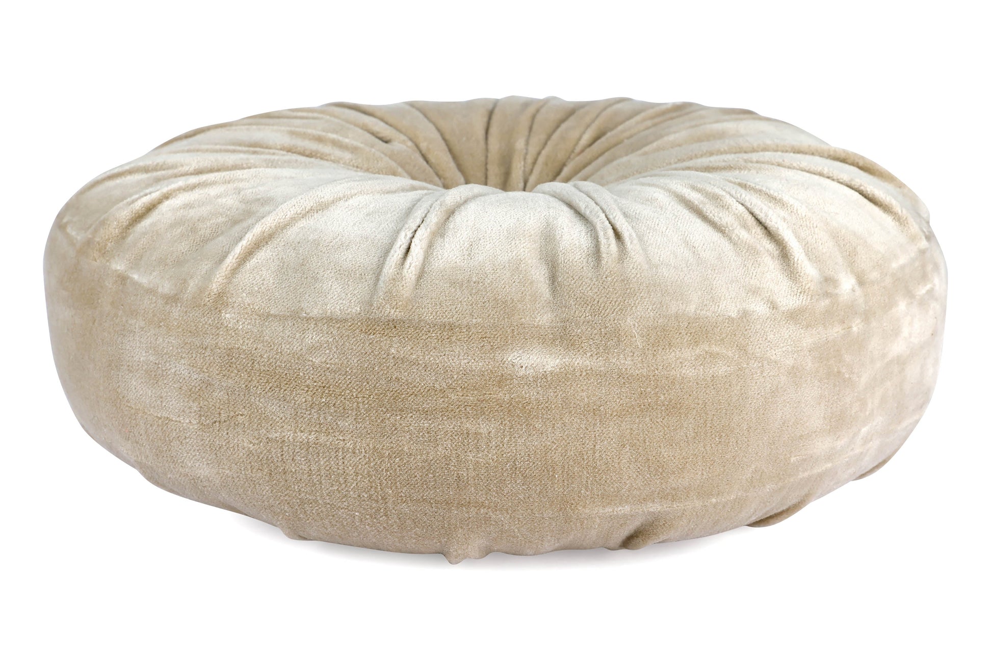 Beige donut pillow bed on a white background