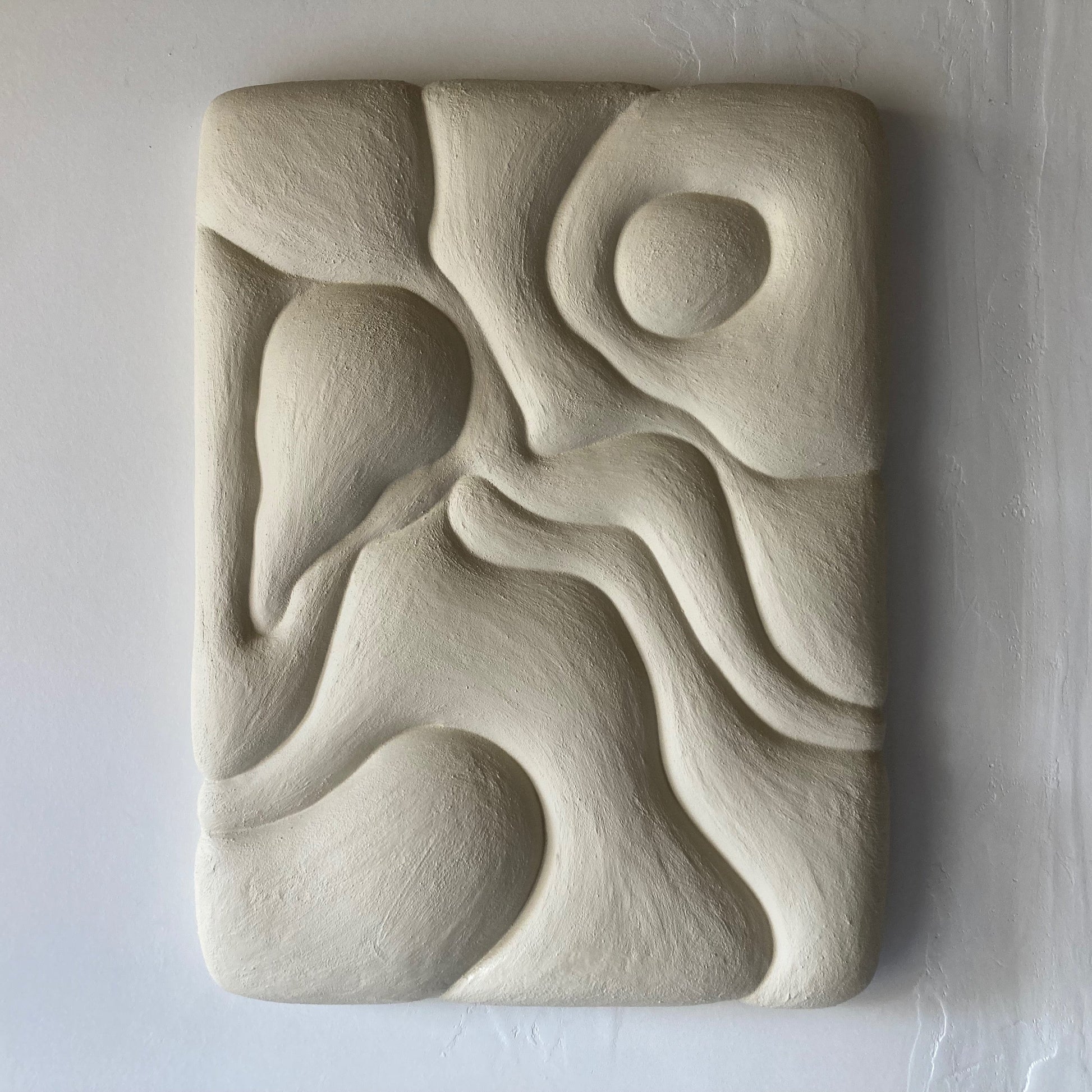 Abstract stone sculpture on a white background
