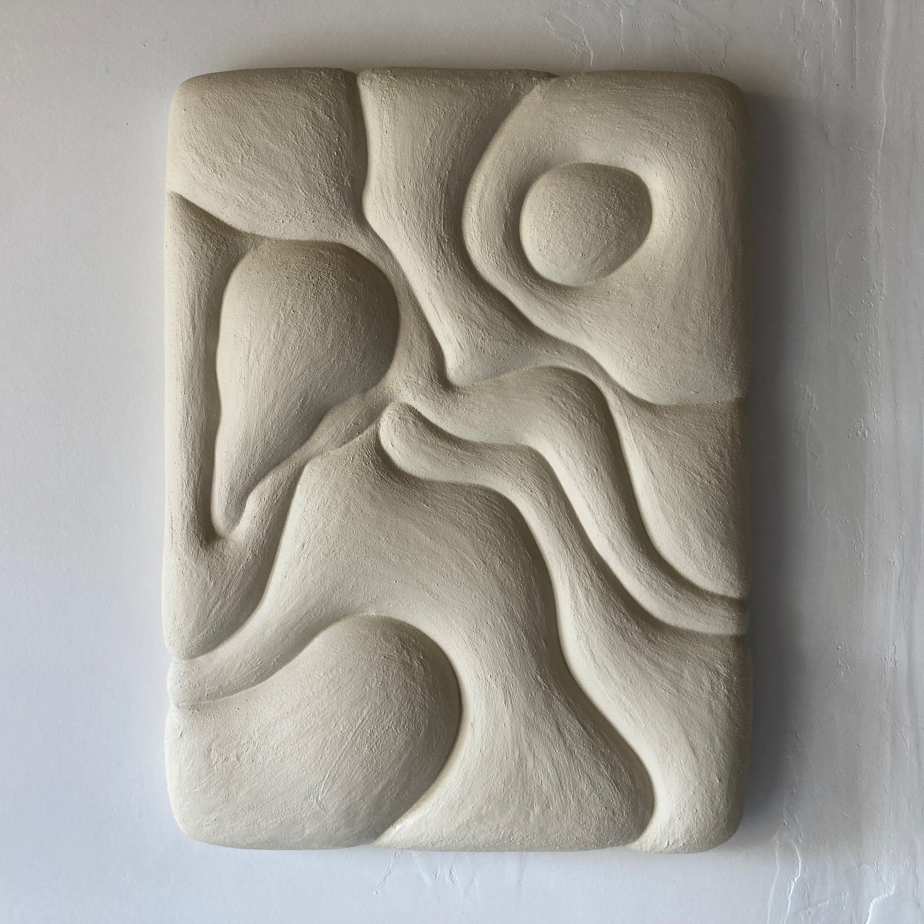 Abstract stone sculpture on a white background