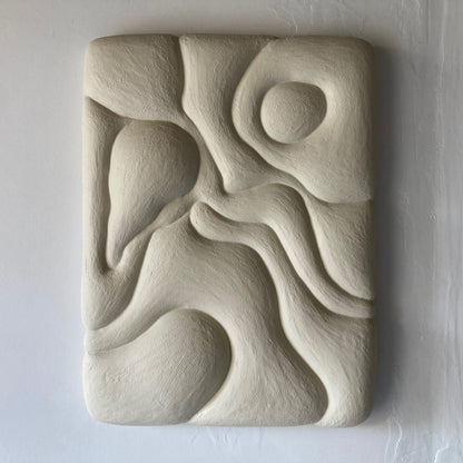 Abstract stone sculpture on a white background