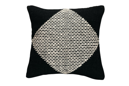 Black pillow with a white geometric pattern on a white background