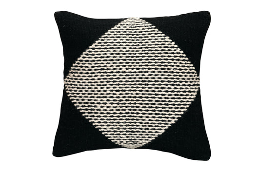 Black pillow with a white geometric pattern on a white background