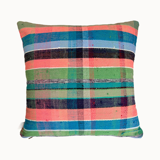 Multicolored plaid pillow on a white background