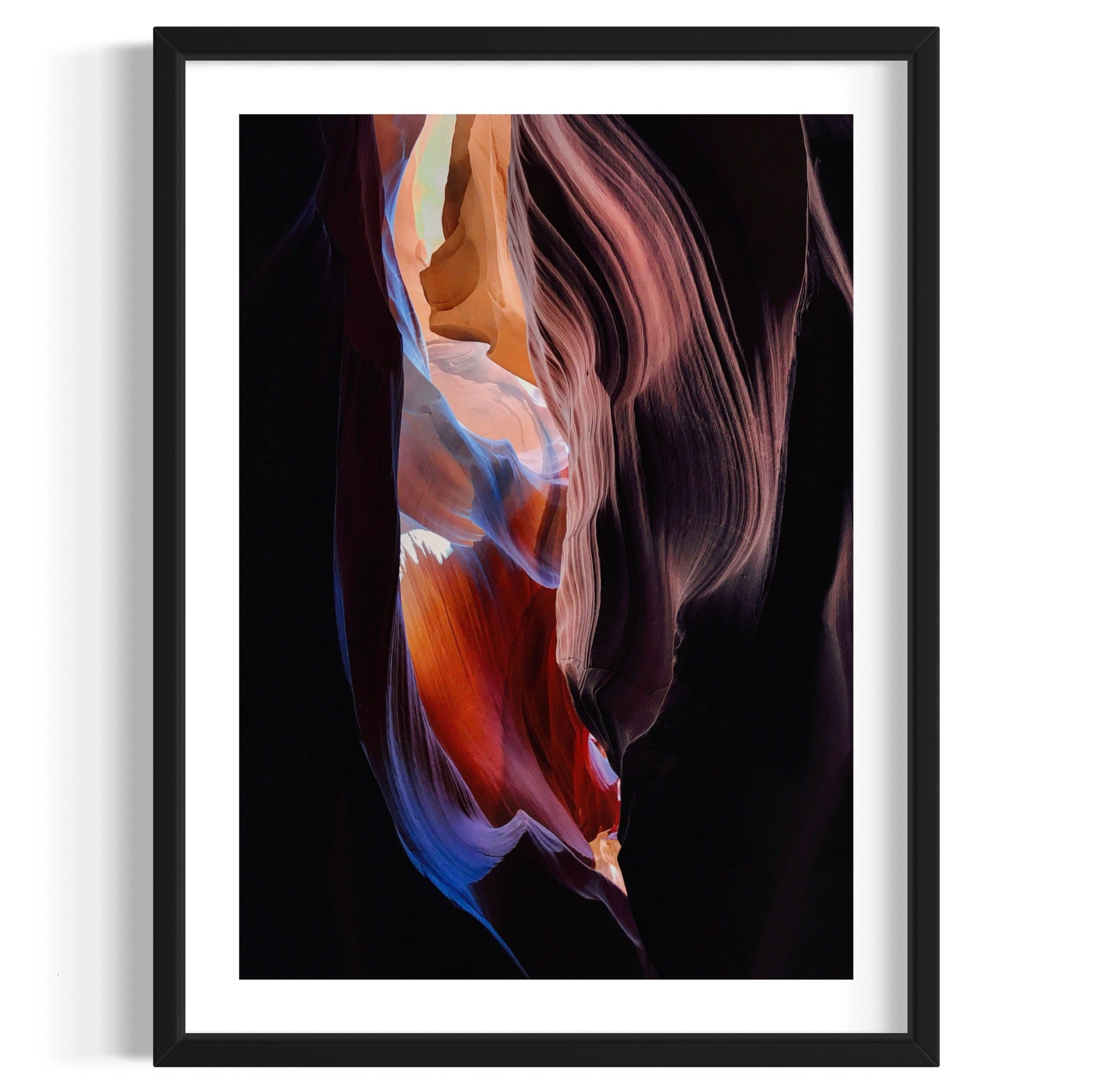 Framed artwork of a colorful abstract design on a black background